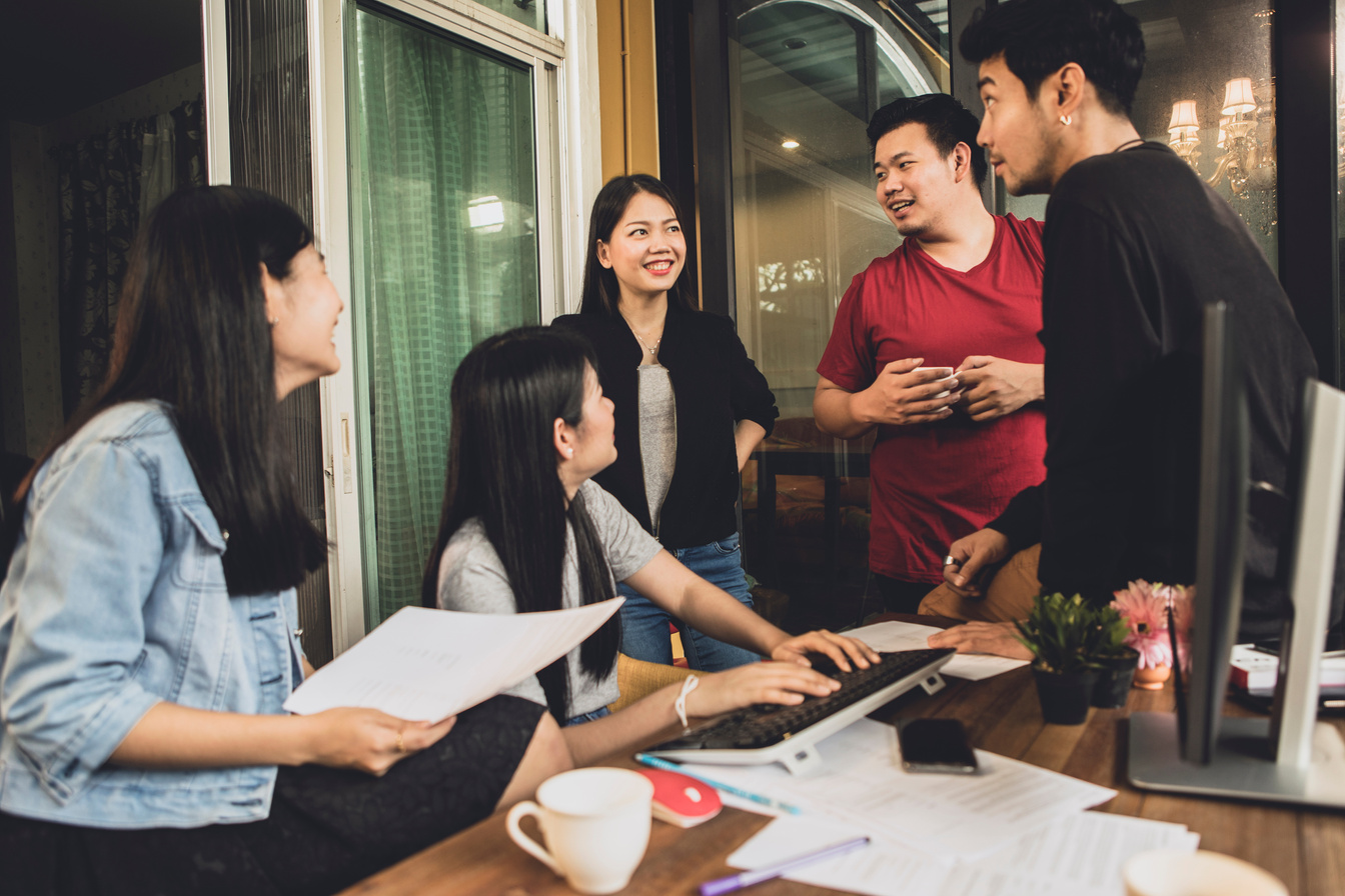 asian freelance team talking with relaxing in home office